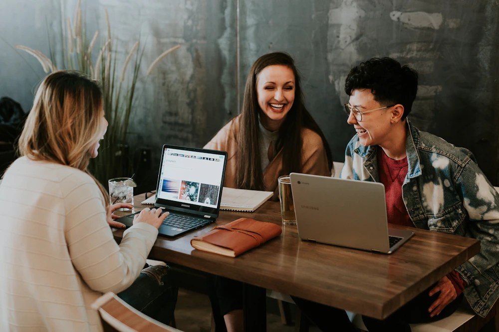 Creative strategists reviewing Meta and Google ad campaigns